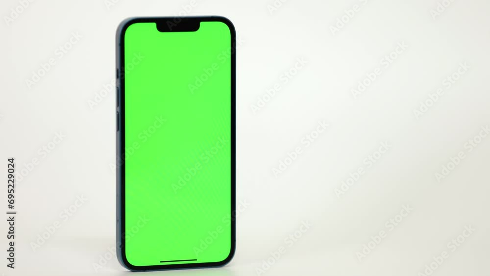 Close Up of Mobile Phone With Green Mock-up Screen On White Background Close Up of Mobile Phone With Green Mock-up Screen On White Background