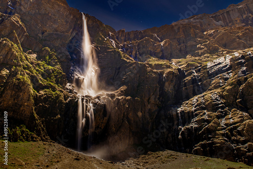 View of the Cirque de Gavarnie at night and its waterfalls, in the French Pyrenees.