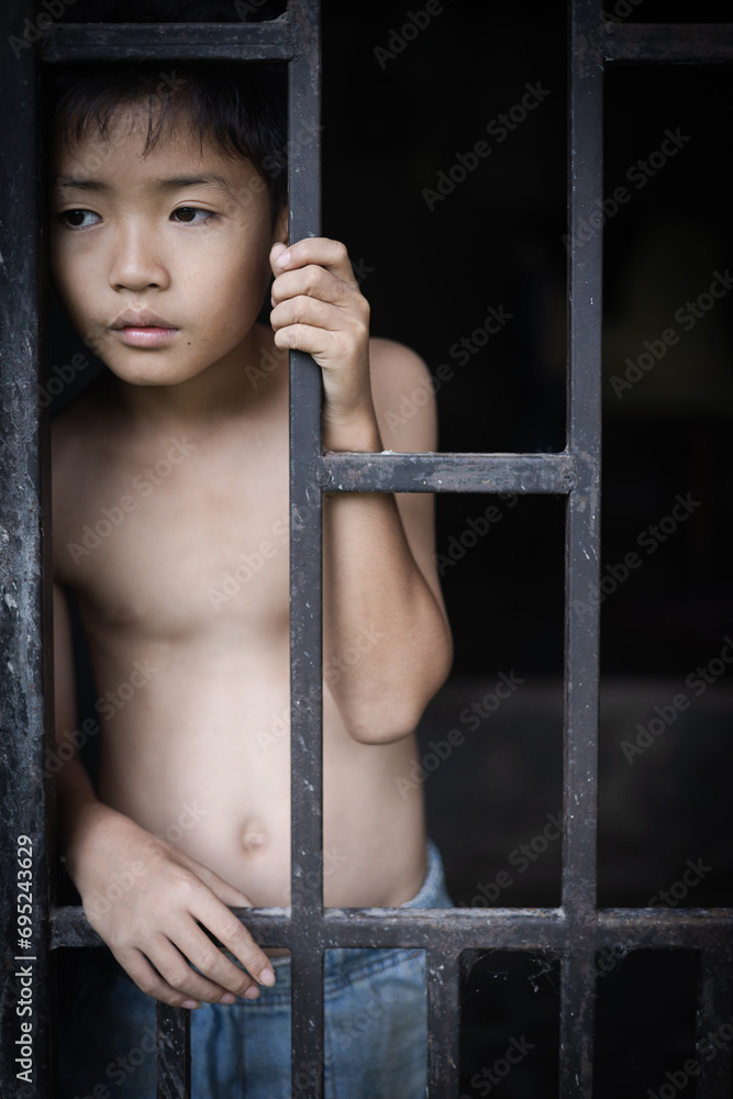 Obraz premium The concept of poor children victims of human trafficking process, poverty, child abuse. child labor concept, victims of human trafficking process, poverty, child abuse, violence against children.