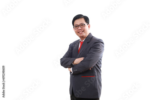 Asian businessman standing with folded hands and looking at the camera. Isolated on white