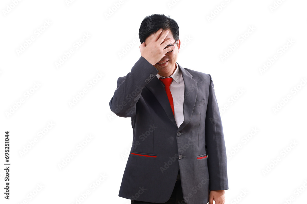 Stressed asian businessman standing while holding his head, suffering from headache. Isolated on white Stressed asian businessman standing while holding his head, suffering from headache. Isolated on white