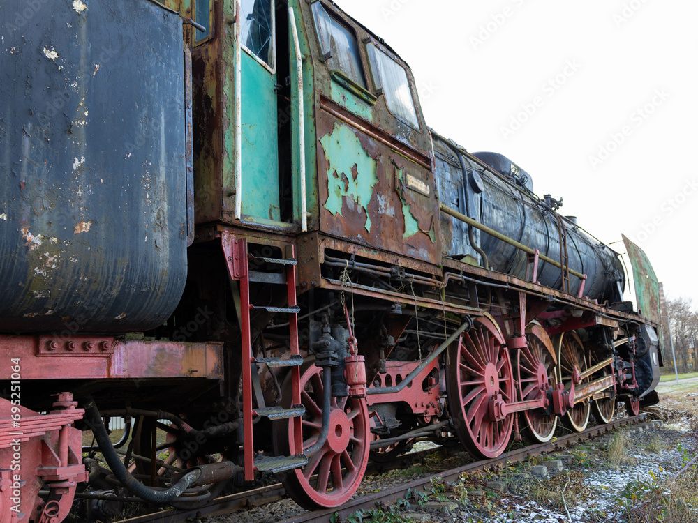 Old rusty train on the tracks. Abandoned retro train