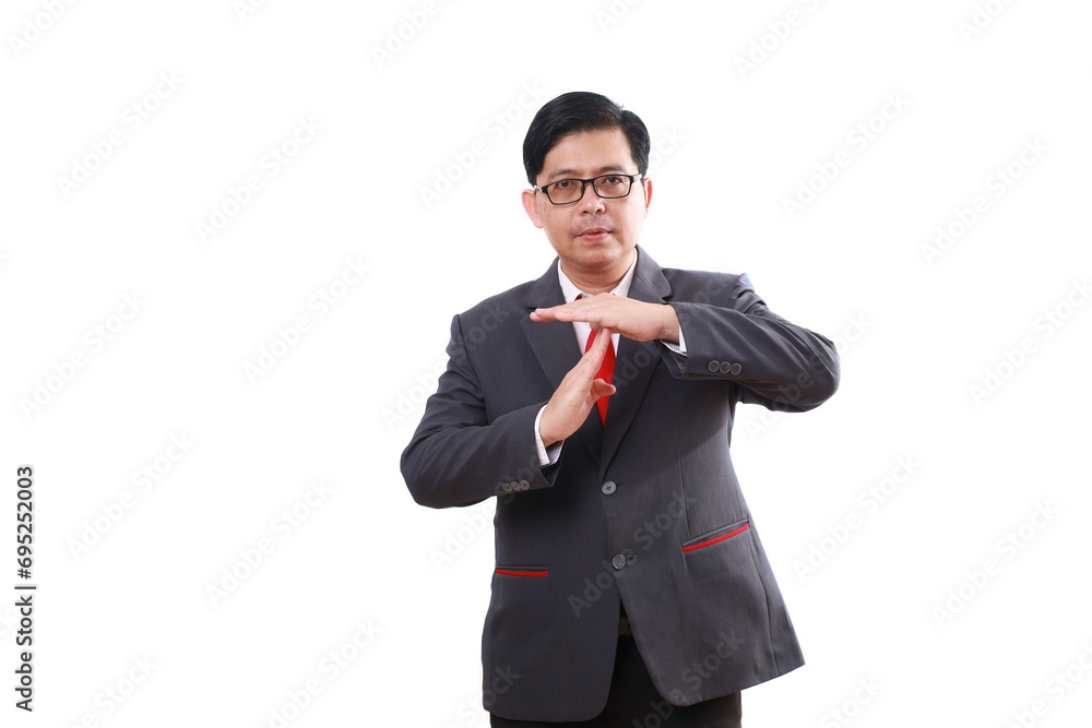 Asian businessman standing while making time out hand gesture. Isolated on white background Asian businessman standing while making time out hand gesture. Isolated on white background