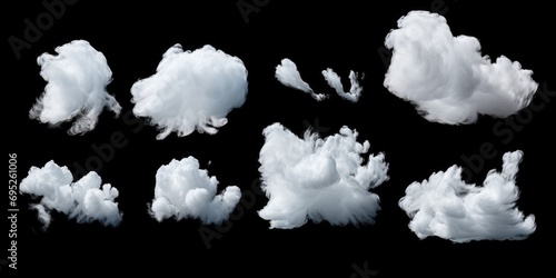 White clouds floating against a black background. Perfect for adding a dramatic touch to any project