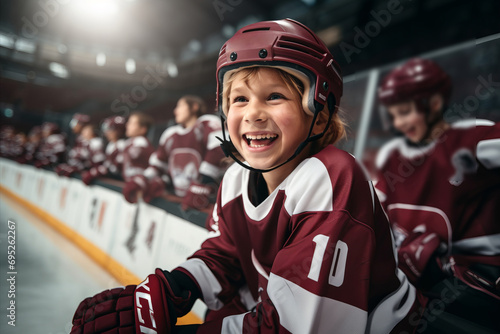 Smiling child hockey player on the ice of a hockey stadium. Hockey training photo