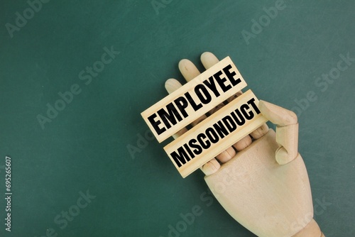Tableau sur toile wooden hand and jayu with the word employee misconduct