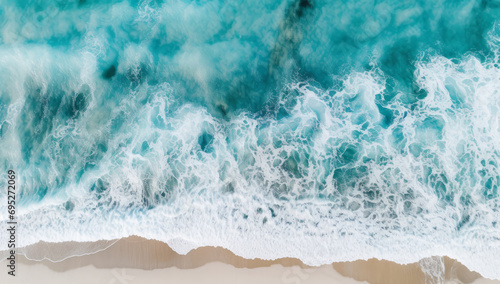 Fototapeta Naklejka Na Ścianę i Meble -  Aerial view of a beach with clear turquoise ocean water. Holiday or vacation scene.