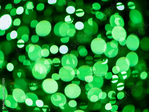 Green bokeh background. Irish luck color theme. Random round shape.