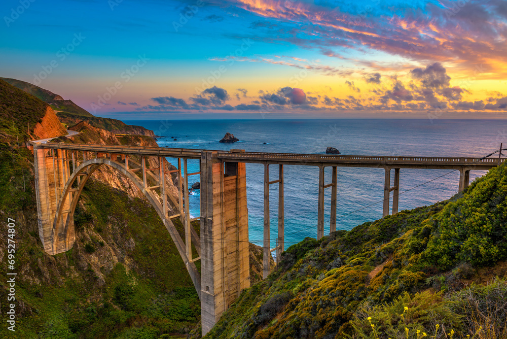 Bixby Bridge also known as Rocky Creek Bridge and Pacific Coast Highway at sunset near Big Sur in California, USA. - obrazy, fototapety, plakaty 