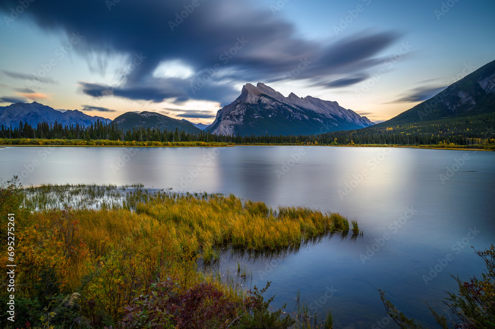 Scenic sunset over Vermilion Lake and Mount Rundle in Banff National Park, Alberta, Canada. Long exposure.