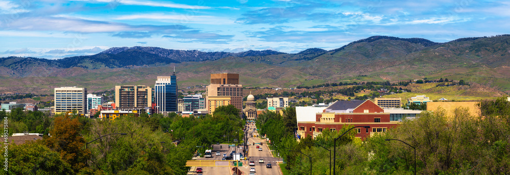 Panorama of downtown Boise, Idaho, with Capitol Blvd leading to the Idaho State Capitol building in summer.