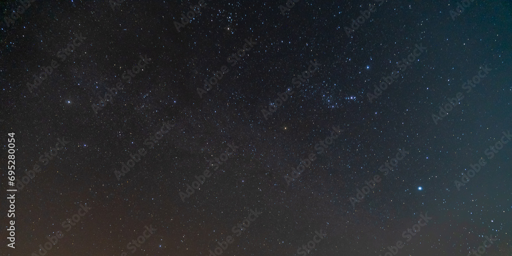 Fototapeta premium star in space with blur dark sky background at night