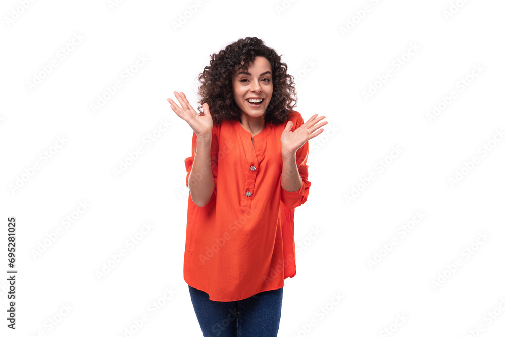young charming brunette woman dressed in an orange blouse on a white background young charming brunette woman dressed in an orange blouse on a white background