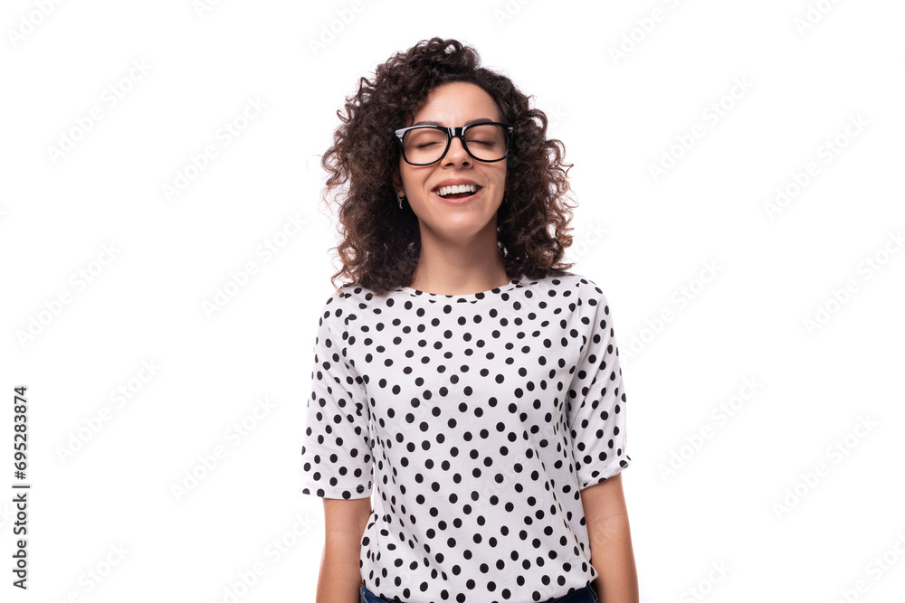 young caucasian woman with curly hair styling dressed in a summer blouse with short sleeves young caucasian woman with curly hair styling dressed in a summer blouse with short sleeves