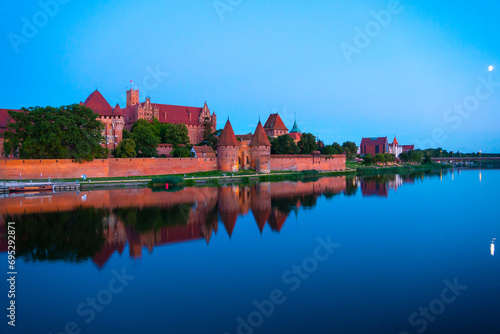 Marienburg castle the largest medieval brick castle in the world in the city of Malbork evening view at night