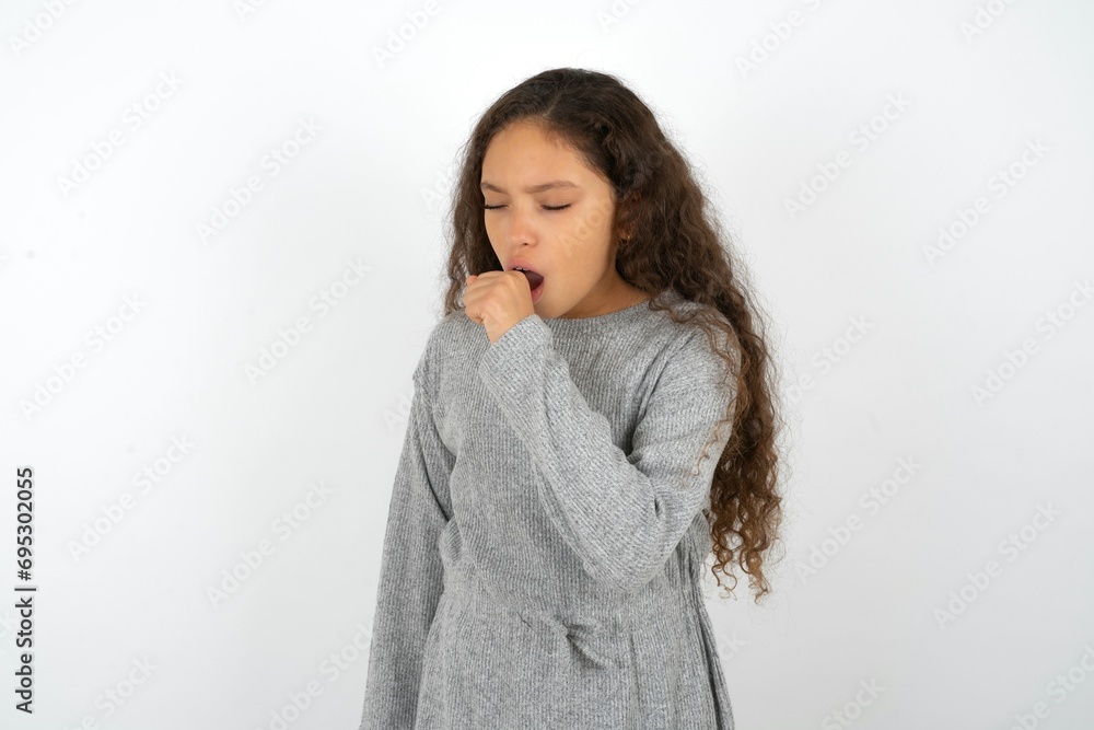 Beautiful teenager girl feeling unwell and coughing as symptom for cold or bronchitis. Healthcare concept. Beautiful teenager girl feeling unwell and coughing as symptom for cold or bronchitis. Healthcare concept.