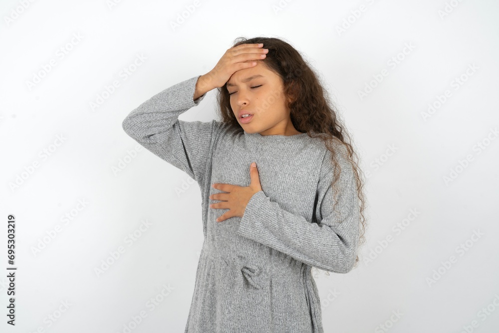 MODEL Touching forehead for illness and fever, flu and cold, virus sick. MODEL Touching forehead for illness and fever, flu and cold, virus sick.