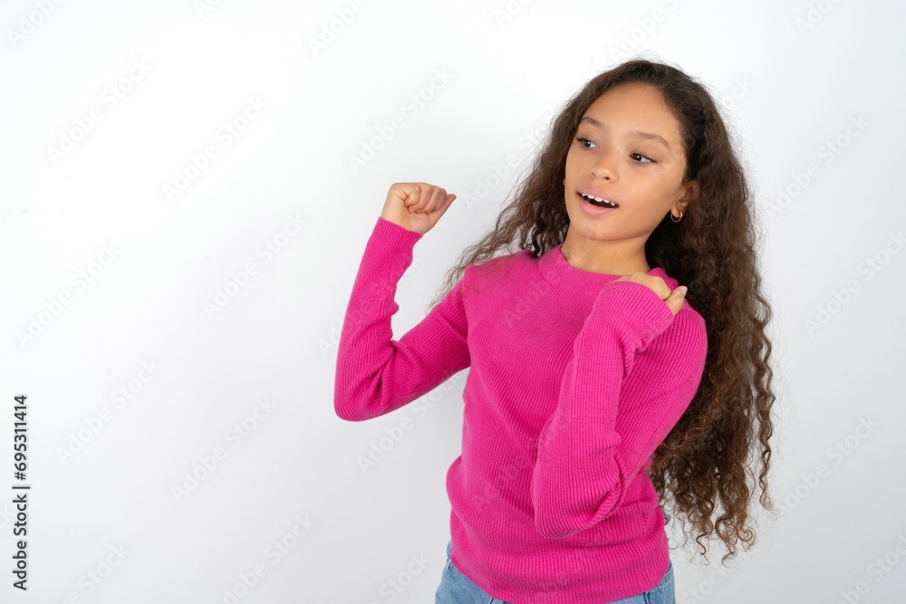 Hooray cool Young beautiful teen girl point back empty space hand fist Hooray cool Young beautiful teen girl point back empty space hand fist