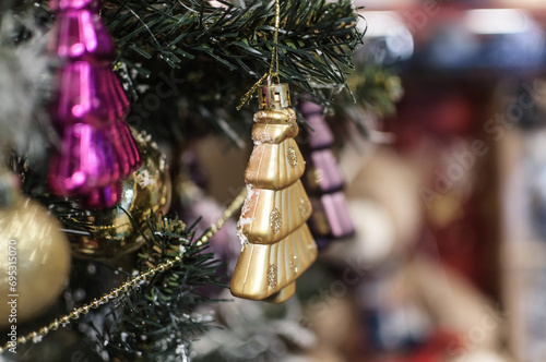colorful Christmas decoration close up details with pine covered with snow and soft focus background
