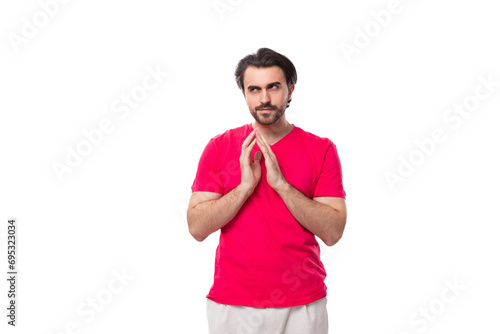 young slender smart brunette advertiser man dressed in a red t-shirt with a mockup