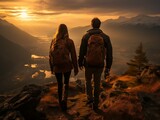 A couple hiking at sunset with a beautiful mountain view