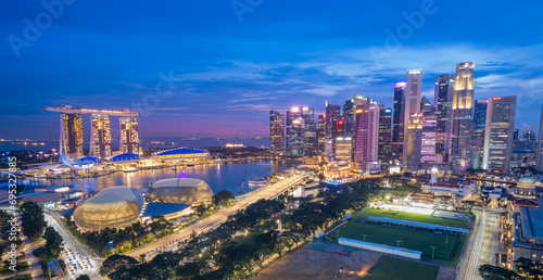 Singapore, Singapore - October 23, 2023: Singapore cityscape at dusk. Landscape of Singapore business building around Marina bay. Modern high building in business district area at twilight. photo