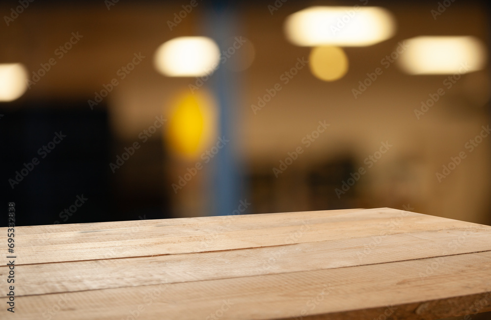 Empty dark wooden table in front of restaurant abstract blurred bokeh background. Can be used to display or mount your products. Mockup for empty space Empty dark wooden table in front of restaurant abstract blurred bokeh background. Can be used to display or mount your products. Mockup for empty space