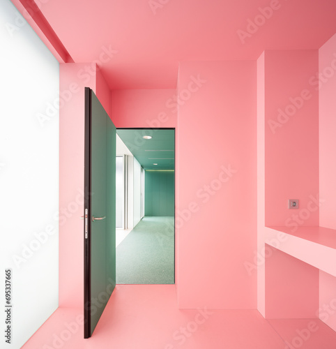 Pink room with open door in hospital