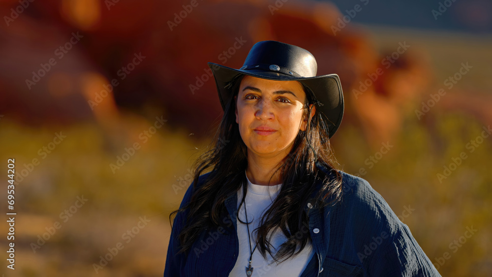 Portrait shot of a cowgirl in the desert at sunset - travel photography Portrait shot of a cowgirl in the desert at sunset - travel photography
