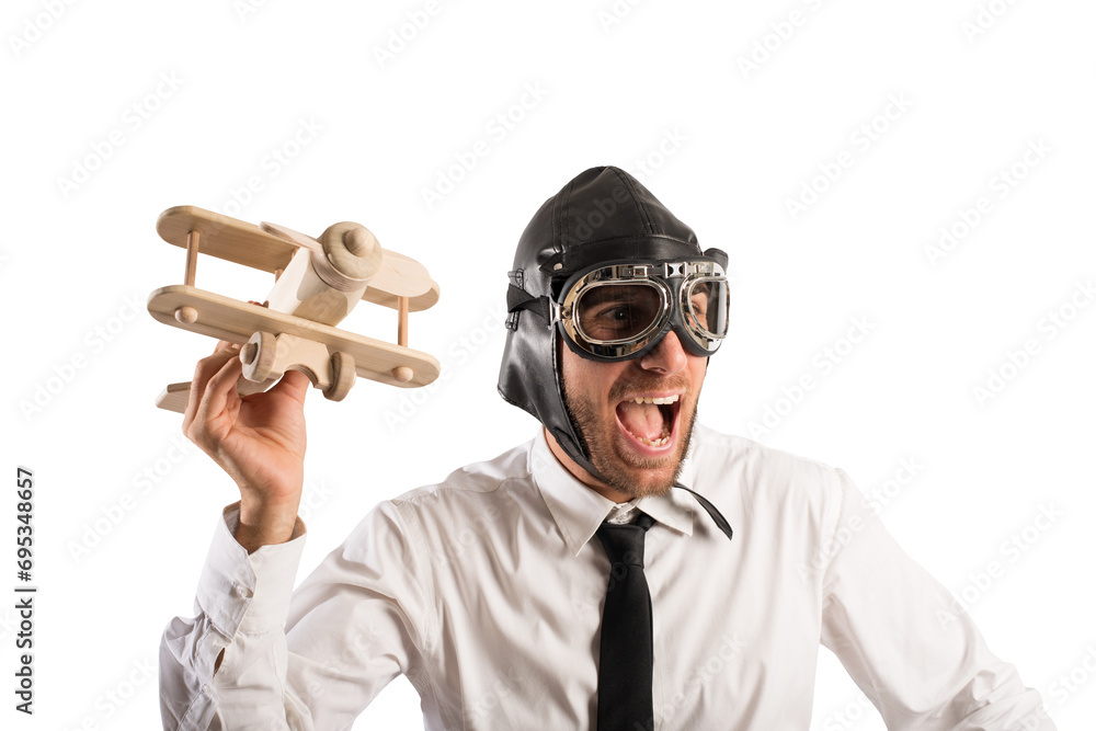 Businessman playing with a wooden aircraft. Concept of startup of a new company Businessman playing with a wooden aircraft. Concept of startup of a new company