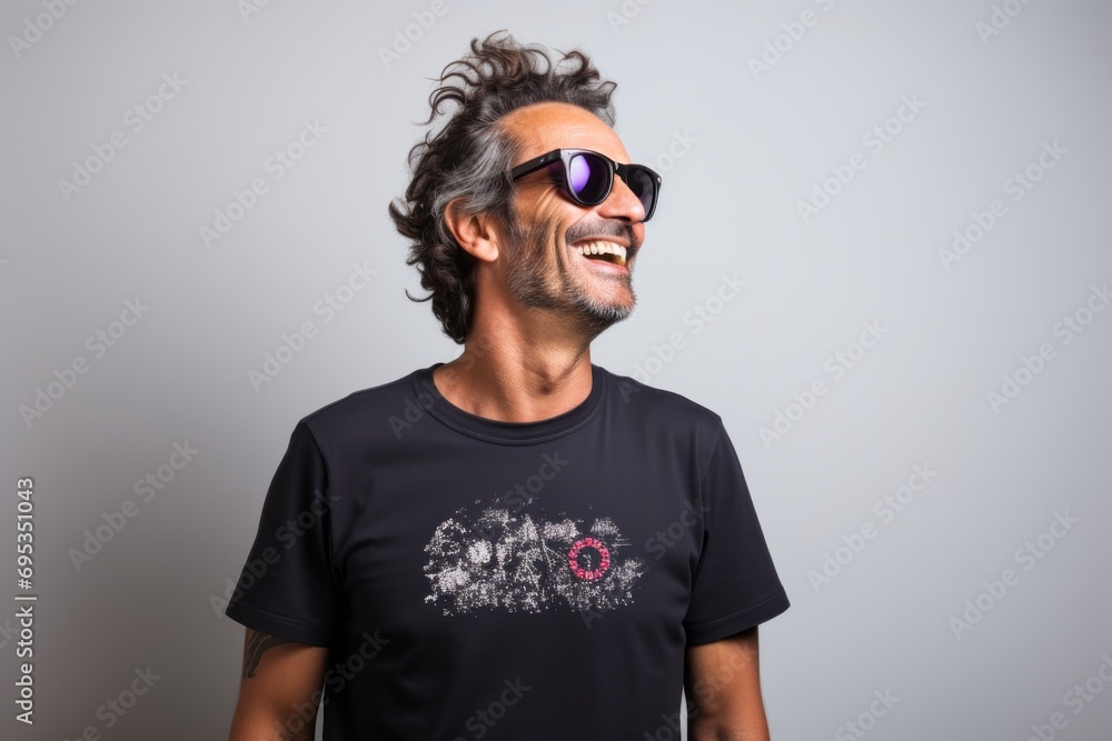 Portrait of a blissful man in his 40s sporting a vintage band t-shirt against a white background. AI Generation Portrait of a blissful man in his 40s sporting a vintage band t-shirt against a white background. AI Generation