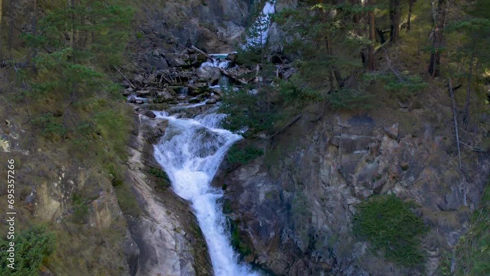 A beautiful waterfall in a mountain gorge in the North Caucasus. Landscape and nature of the North Caucasus A beautiful waterfall in a mountain gorge in the North Caucasus. Landscape and nature of the North Caucasus