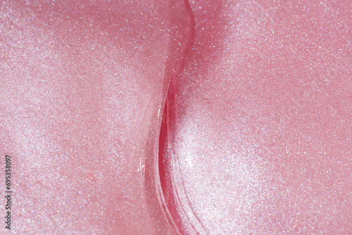 Close-up view of shimmery pink texture with a curve