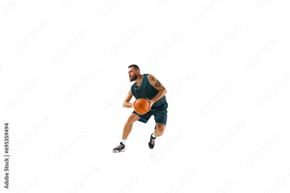 Basketball professional in uniform, exhibiting flawless dribbling technique and executing impressive slam dunk against white background.