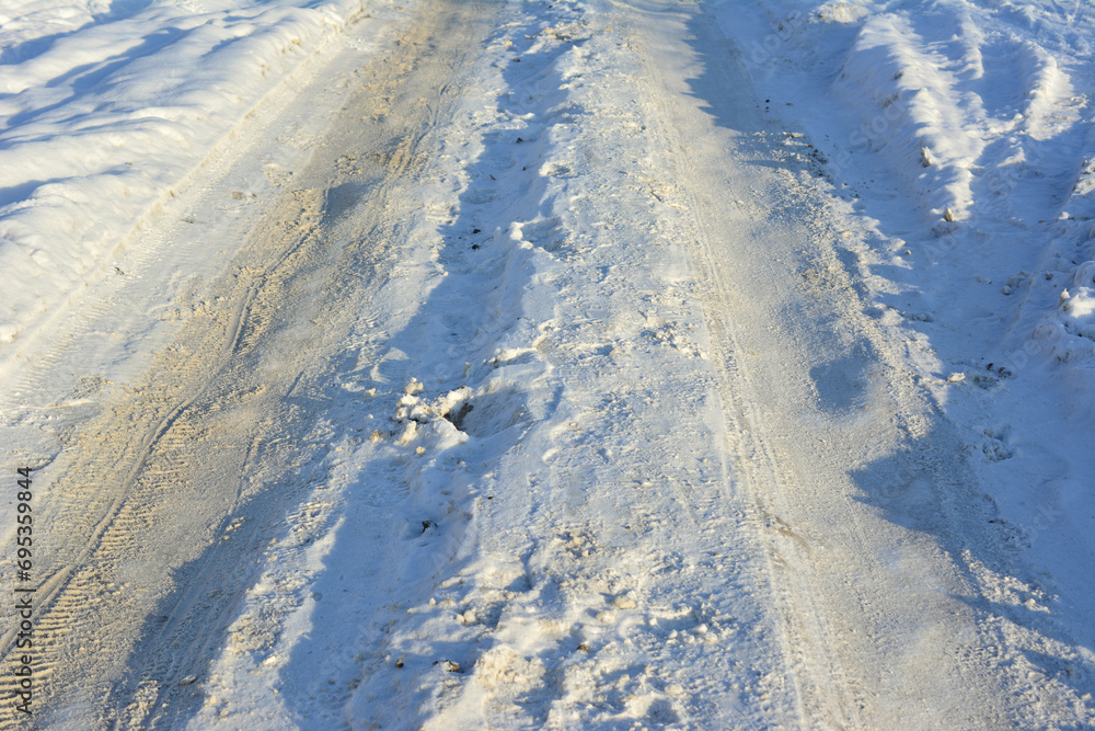 Fototapeta premium snowy road with tire track isolated 