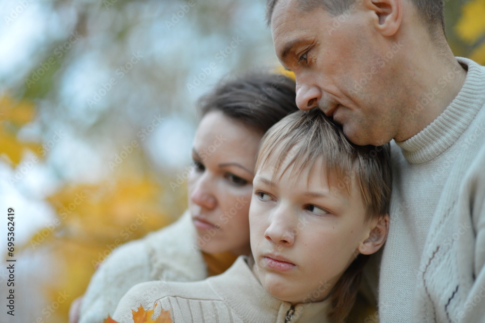 Portrait of a family of three on the nature Portrait of a family of three on the nature