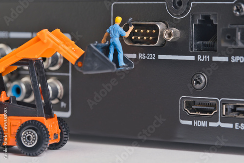 Obraz na plátně Repairing an old socket serial port, dusty old interface, miniature figures scen