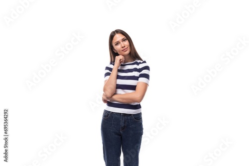 close-up of a young brunette woman model dressed in a striped t-shirt and jeans. people lifestyle concept