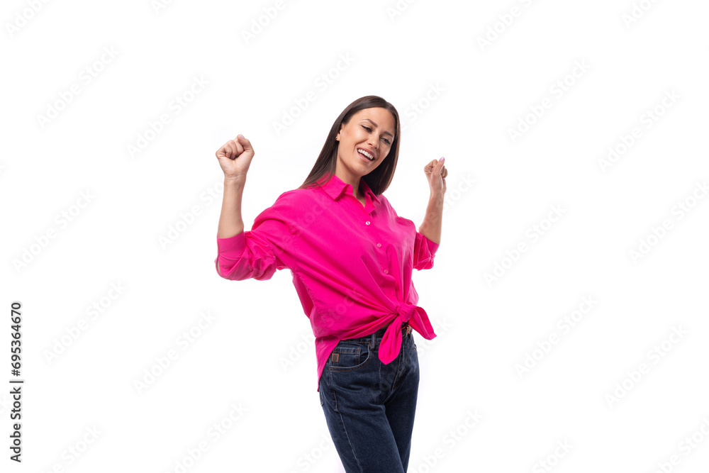 young successful brunette female leader wears bright pink shirt tied at the waist young successful brunette female leader wears bright pink shirt tied at the waist