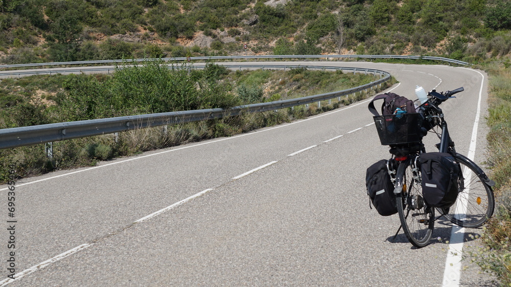 Obraz premium A bicycle on the road between Peramola and Politg in Catalonia, in the month of July