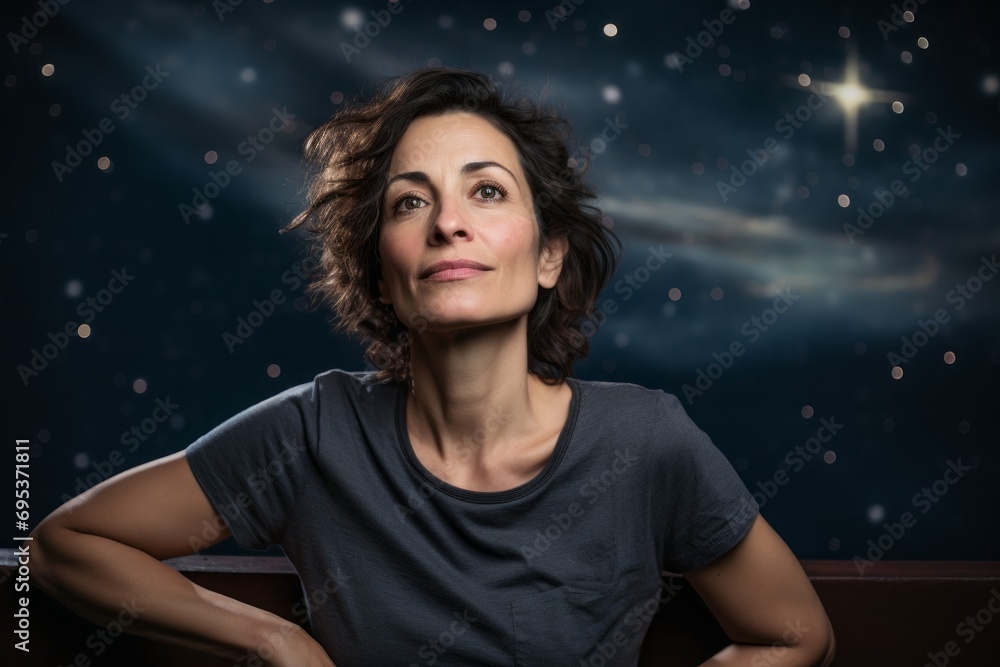 Portrait of a satisfied woman in her 40s sporting a vintage band t-shirt against a backdrop of starlit galaxies. AI Generation Portrait of a satisfied woman in her 40s sporting a vintage band t-shirt against a backdrop of starlit galaxies. AI Generation
