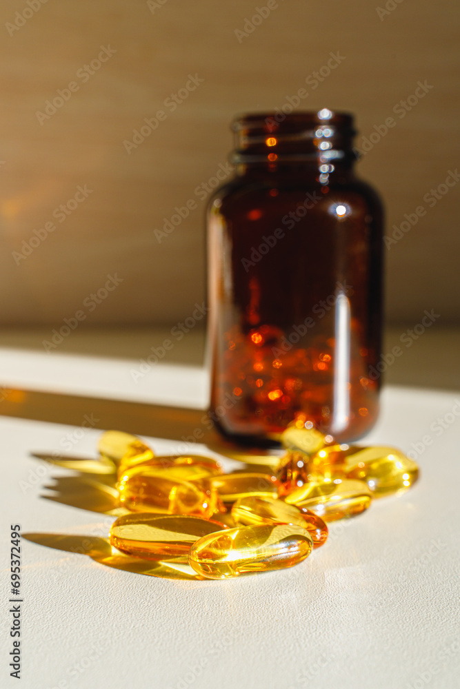 Omega 3 capsules on the table. Bottle of fish oil. Omega 3 capsules on the table. Bottle of fish oil.