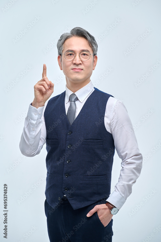 A middle-aged man in a suit expresses various emotions through facial expressions and hand gestures. A middle-aged man in a suit expresses various emotions through facial expressions and hand gestures.