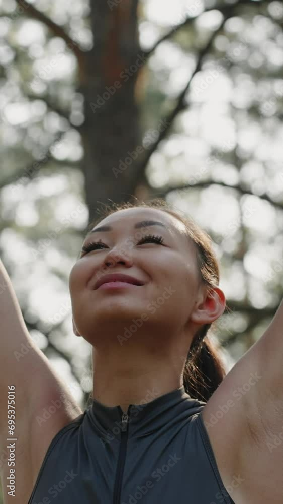 Attractive Asian woman enjoying in the forest Attractive Asian woman enjoying in the forest