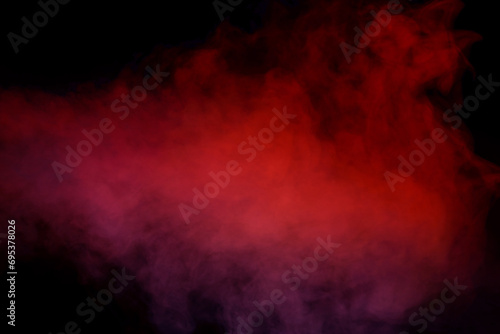 Orange and red steam on a black background. © Nikolay
