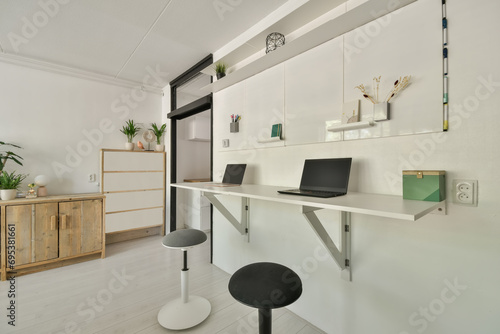 Modern minimalist home office with wall-mounted desk photo
