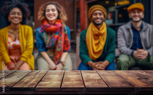 Wooden, empty table with a blurred background, of people of different cultures, age, sex and color.