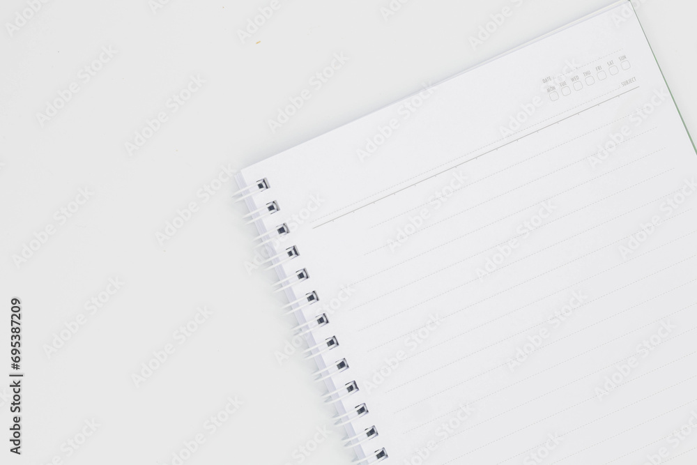 Notepad with a pencil on white background, spiral blank craft paper notebook with pencil Notepad with a pencil on white background, spiral blank craft paper notebook with pencil