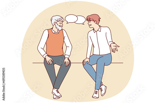 Old and young men sitting together talking. Older and younger male generation with speech bubbles engaged in conversation. Vector illustration.