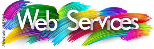 Web services paper word sign with colorful spectrum paint brush strokes over white.